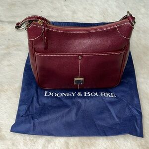 EUC Dooney and Bourke Saffiano leather.  Burgundy color with dust bag.